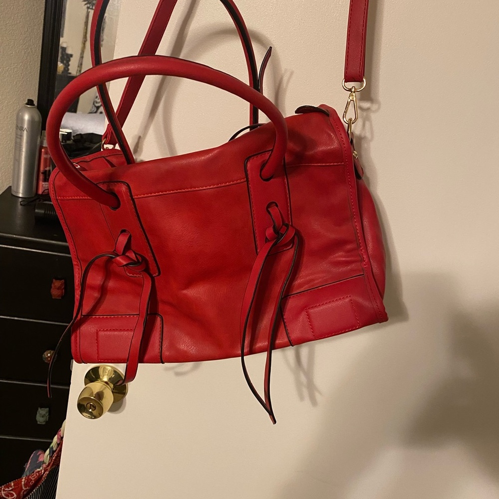 Red large purse with added shoulder strap